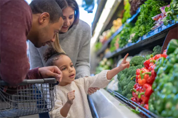 graphic image of a family grocery shopping